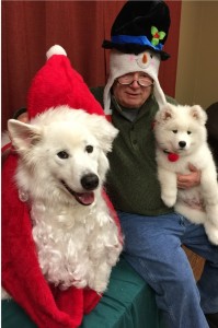 Todd Orthmann and his dogs at The Women’s Community Holiday Open House; kids attending got their photos taken with the dogs