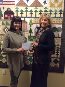 WPS Employees donation, with representative Kelly Zagrzebski